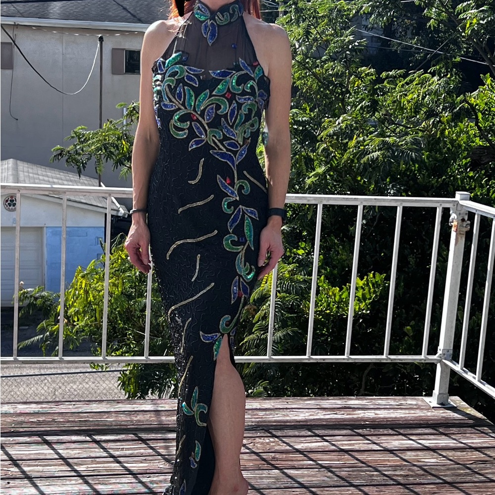 NWT beautiful beaded dress with slit in front. Never worn. Size 7/8. Paid $497.
